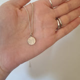 Round floral disc necklace