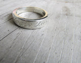 Engraved tapered ring