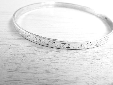 Bangle engraved with GPS coordinates