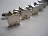 Square cufflinks with initials engraved in corners