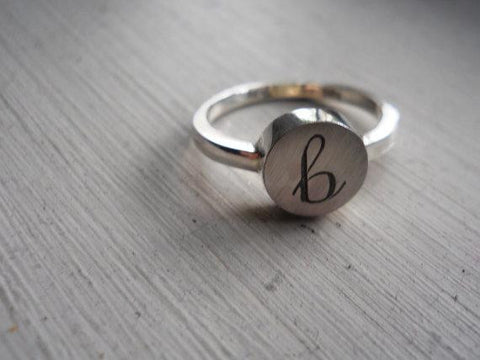 Engraved initial ring