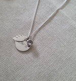 Memory necklace with angel wing and white topaz