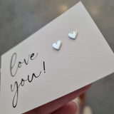 heart earrings on Love you card